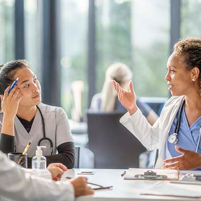 A group of medical professionals in a meeting A group of medical professionals in a meeting